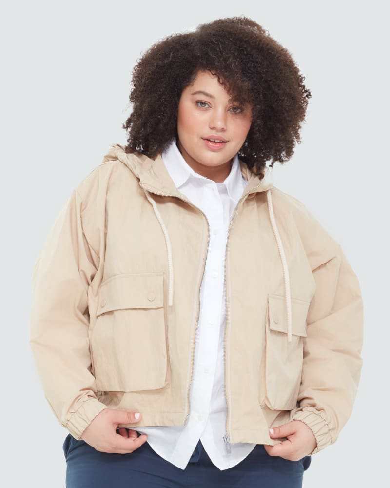 Front of a model wearing a size 0X Marina Hooded Utility Anorak Jacket in Dusty Tan by DEX PLUS. | dia_product_style_image_id:268439